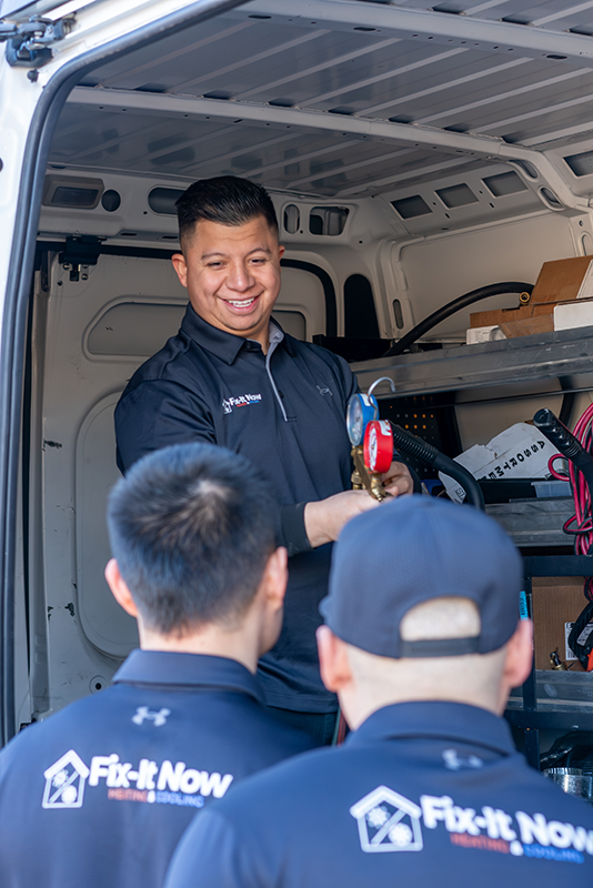 hvac technicians in work van