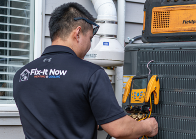 hvac technician workong on outside ac unit